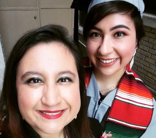 Itzel and her mother on graduation day