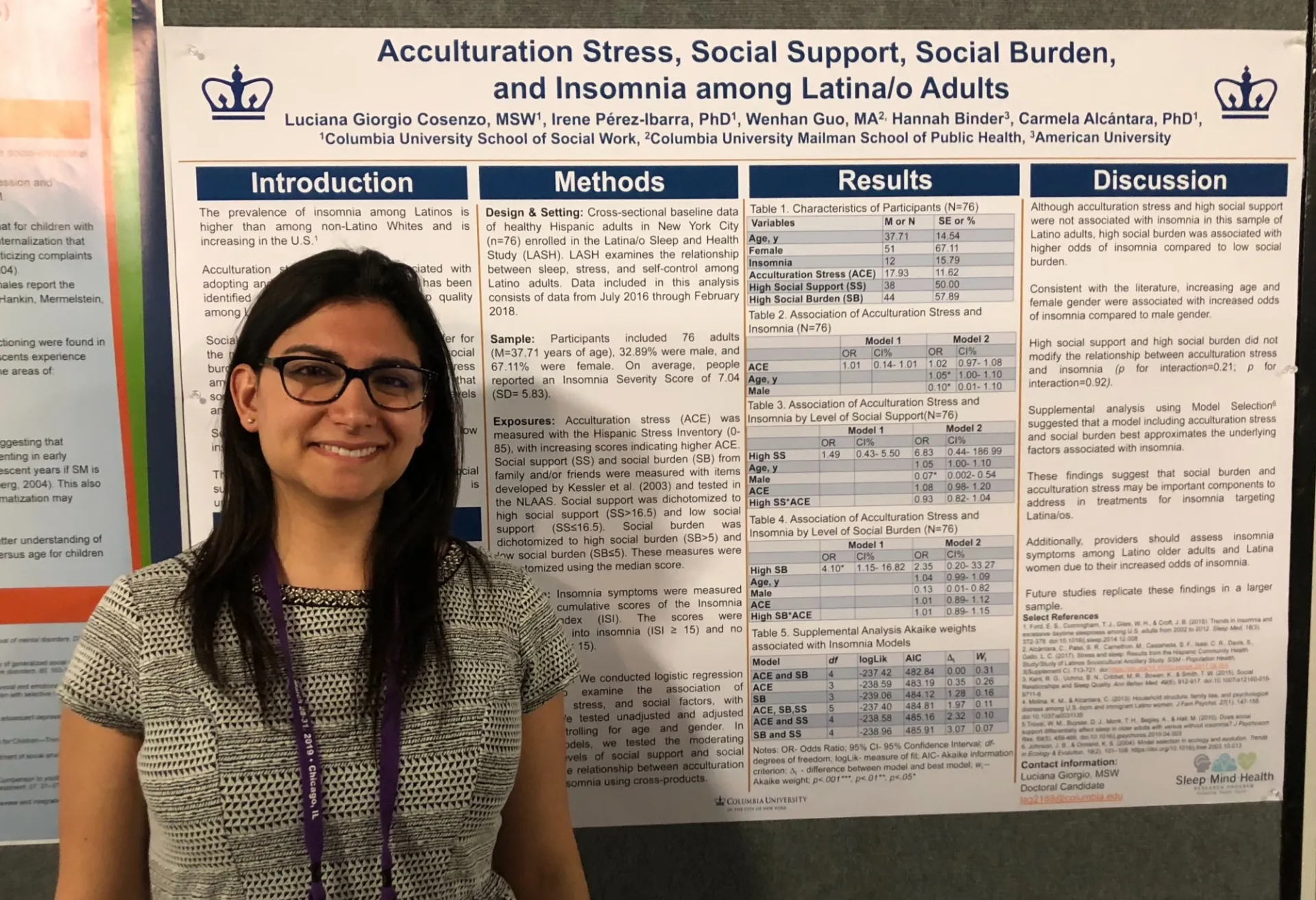 Luciana stands in front of her scientific poster