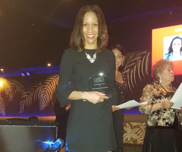 Dr. Carmela Alcántara with award